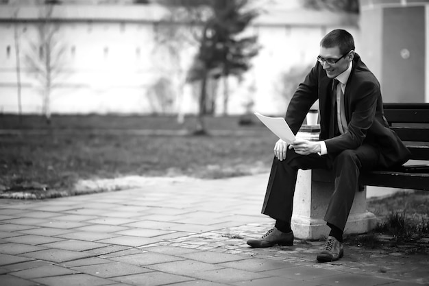 Businessman in a suit on the street black-and-white photo