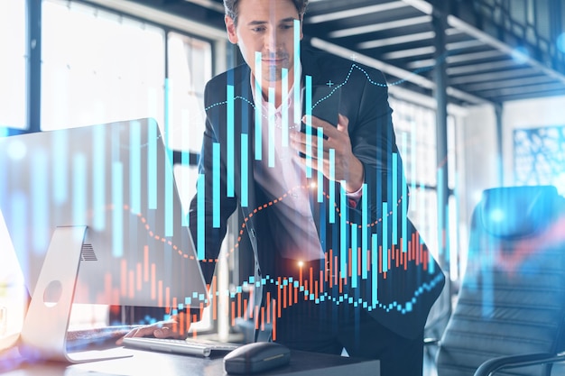 Businessman in suit using smart phone to optimize trading strategy at corporate finance fund Forex chart hologram over modern panoramic office background