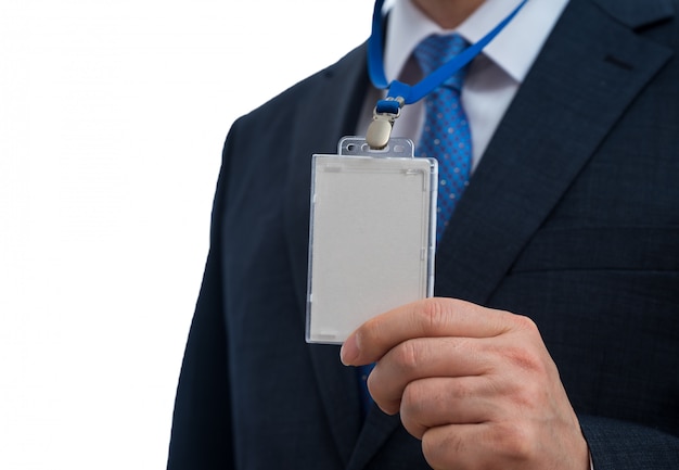 Photo businessman in suit wearing a blank id tag or name card on a lanyard at an exhibition or conference.