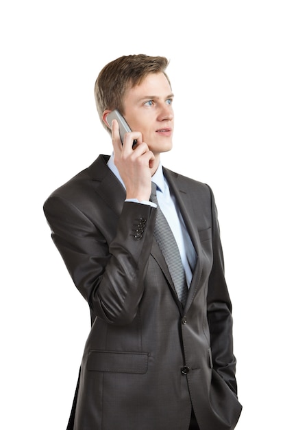 Businessman talking on a mobile phone. isolated