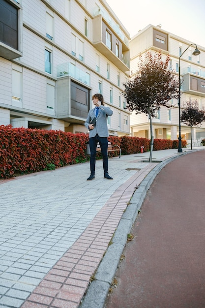 Businessman talking on the mobile in the street