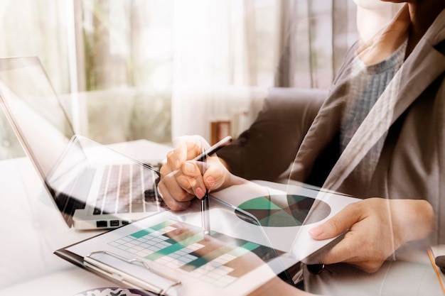 Businessman and team analyzing financial statement Finance task with smart phone and laptop and tablet Wealth management concept