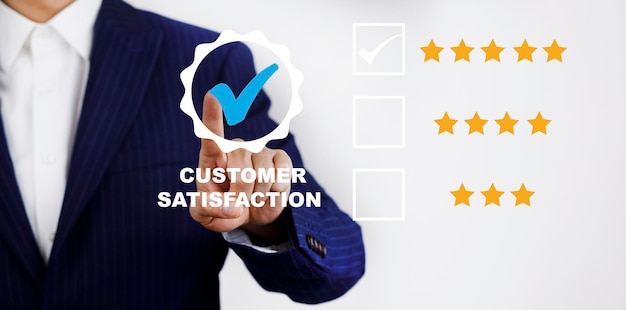 Businessman touch with Customer review satisfaction feedback survey concept User give rating to service experience on online application service leading to reputation ranking of business