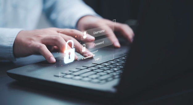 Businessman typing on keyboard laptop computer to input username and password for or technology security system and prevent hacker concept