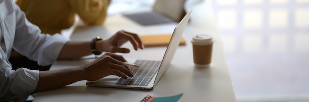 businessman typing on laptop  in co-working space