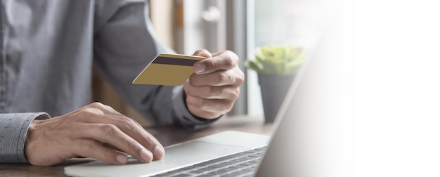 Businessman use credit card to spend money or pay for goods and online services