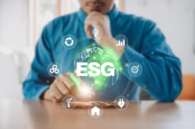 Businessman use phone for analyze Environmental technology and approaching global sustainable ESG by clean energy and power ESG environmental social governance business strategy investing concept