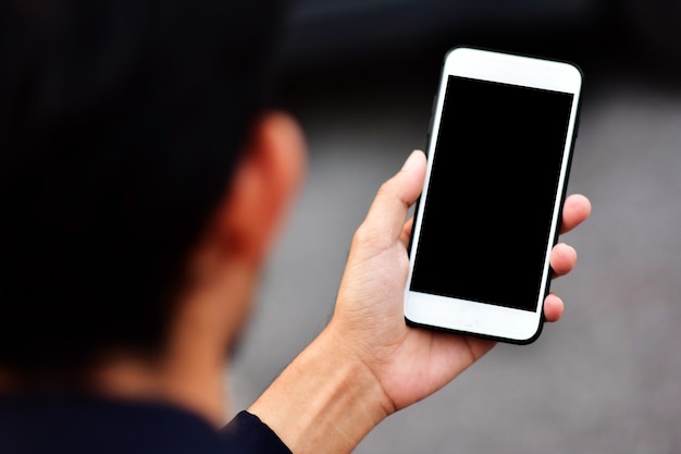 Businessman use smartphone looking on screen mobile phone technology