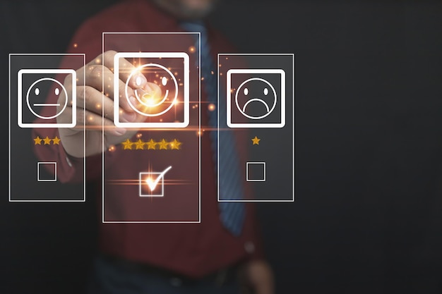 The businessman uses a pen to touch the virtual screen on the happy smiley face icon top 5 star with copy space Satisfaction to service high Customer service business concept rating very impressed