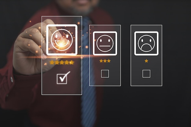 The businessman uses a pen to touch the virtual screen on the happy smiley face icon top 5 star with copy space Satisfaction to service high Customer service business concept rating very impressed