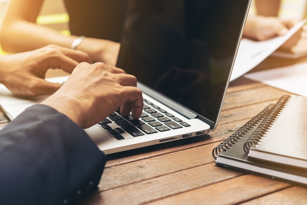 Businessman using laptop in Business meeting