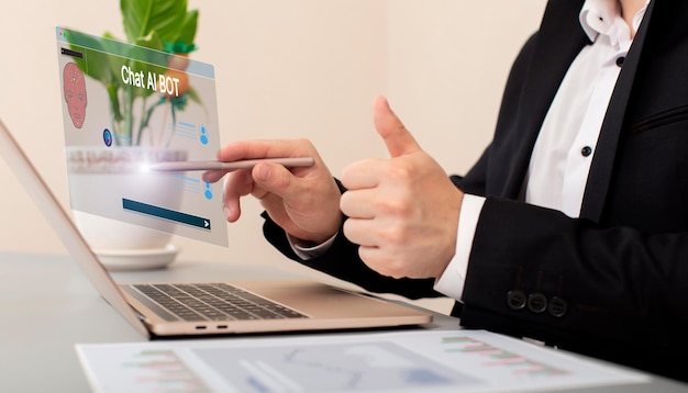 Businessman using a laptop computer chatting