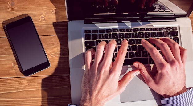 Businessman using laptop at desk