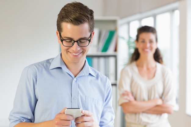 Businessman using mobile phone in office