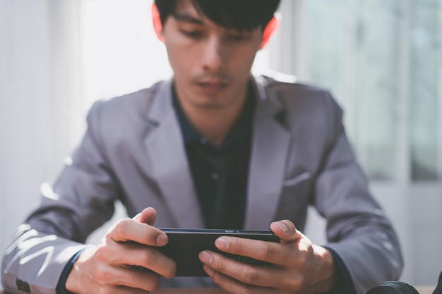 Businessman using smart phone to work, communicate.