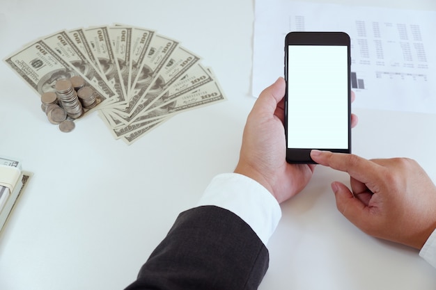 Businessman using smartphone in office