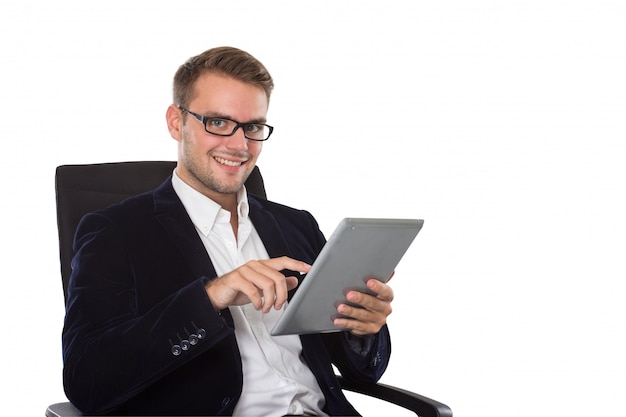 Businessman using a tablet pc, smiling