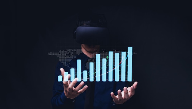 Businessman using Virtual Reality Metaverse glasses to virtual world showing bar graph business growth