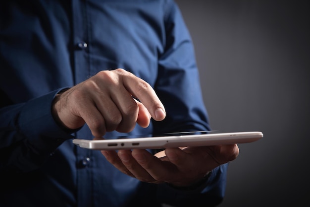 Businessman using white digital tablet