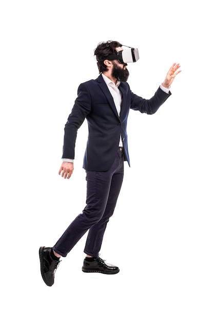 Businessman in virtual reality glasses, presses invisible buttons, isolated on white background