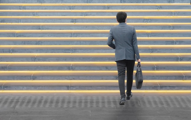 Businessman walking on stairs