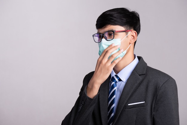 Businessman wearing Protective face mask, Coronavirus and pm 2.5 fighting concept.