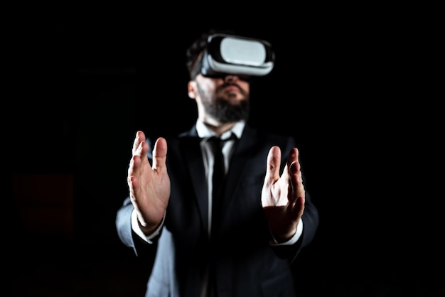 Businessman Wearing Virtual Reality Headset Gesturing And Taking Professional Training Through Simulator Man In Suit Presenting Modern Technology Of Innovative Learning