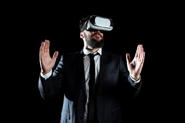 Businessman Wearing Virtual Reality Headset Gesturing And Taking Professional Training Through Simulator Man In Suit Presenting Modern Technology Of Innovative Learning