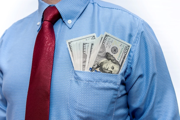 Businessman with dollar banknotes in pocket close up