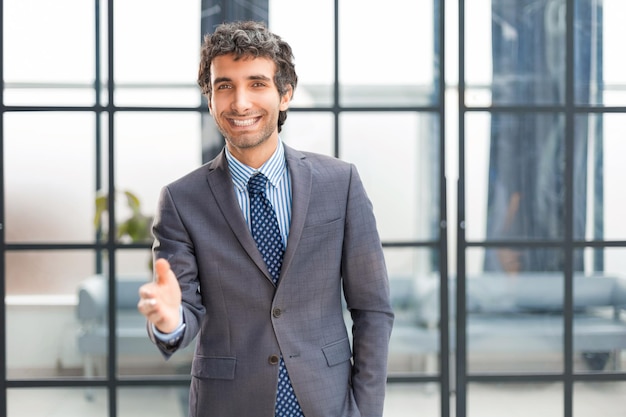 Businessman with an open hand ready to seal a deal