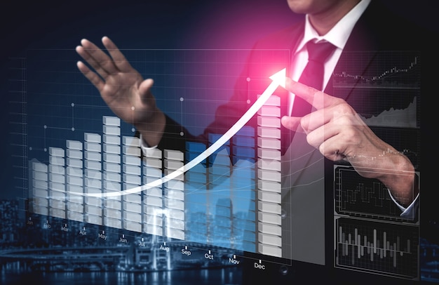 Businessman with report chart up forward to financial profit growth of stock market investment.