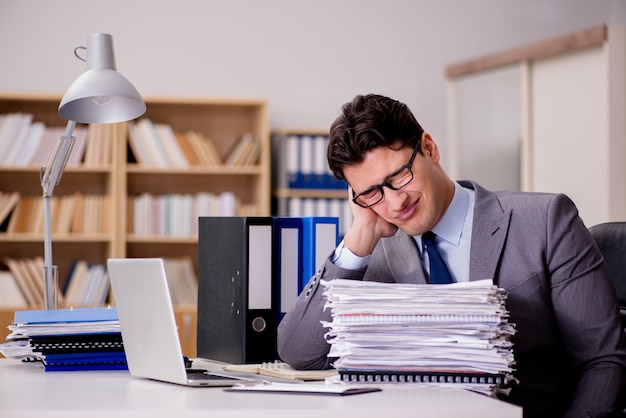 Businessman with too much paperwork