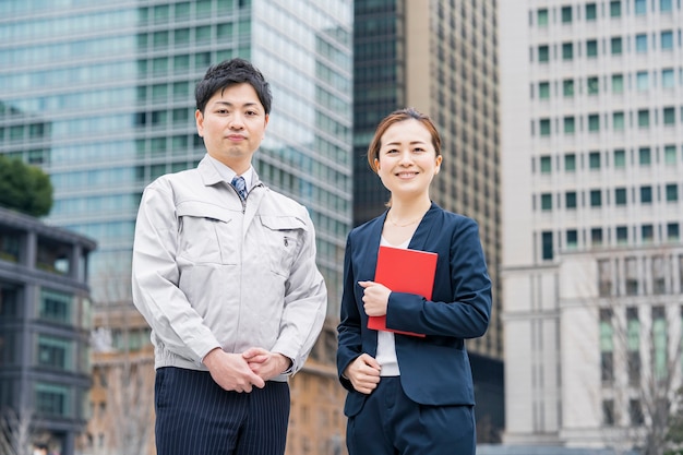 A businessman in work clothes and a business woman in a suit