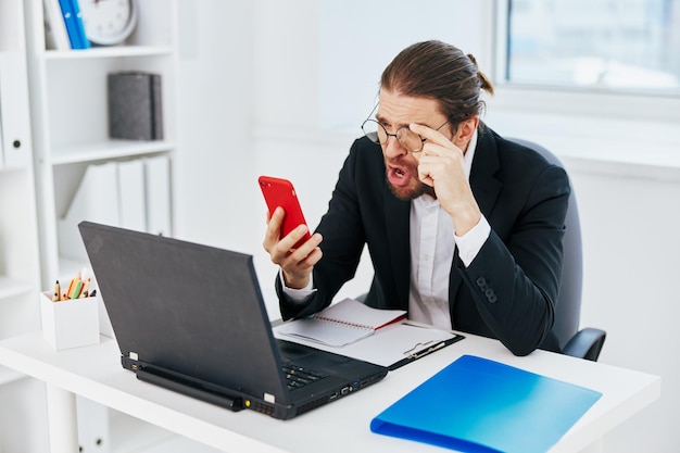 Businessman work in the office in front of a laptop lifestyle