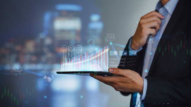 Businessman work with ai for economy analysis financial result by digital augmented reality graph