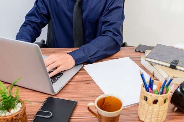 Businessman work with laptop in desk