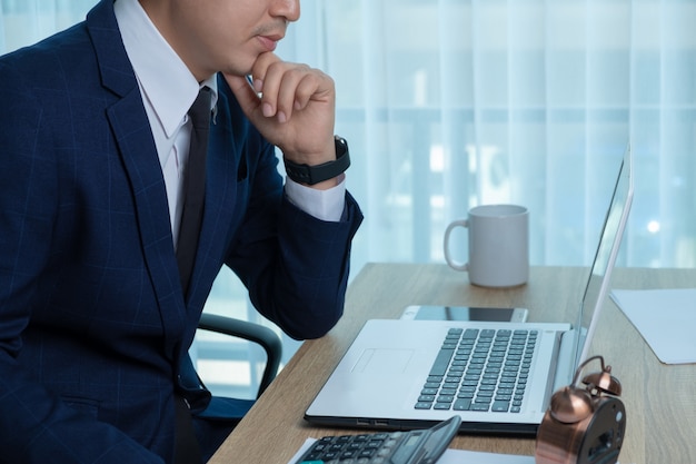 Businessman working at the desk in the office