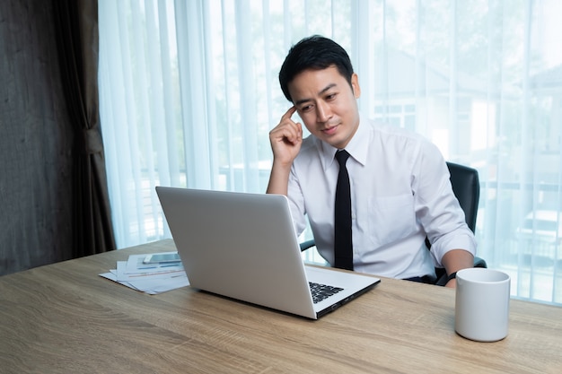 Businessman working at the desk in the office