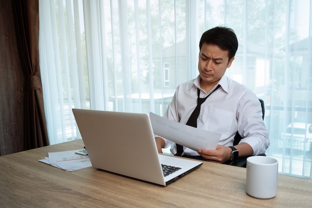 Businessman working at the desk in the office