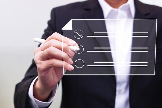 Businessman working on a digital document a virtual screen using a stylus pen. Concept of Technology