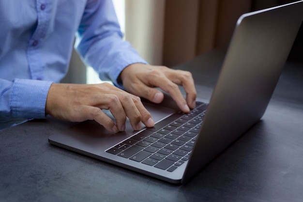 Businessman working digital marketing in virtual screen at the table with laptop