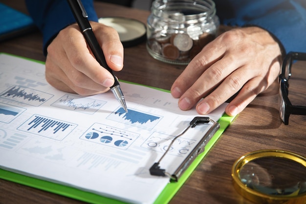 Businessman working in financial graphs