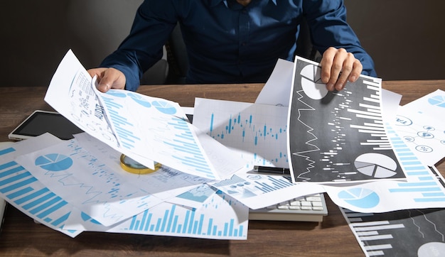 Businessman working in financial graphs