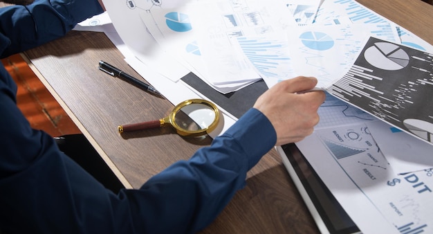 Photo businessman working in financial graphs