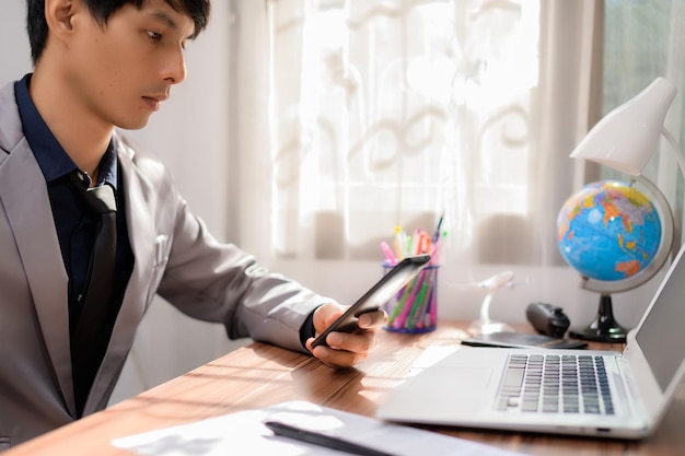 Businessman working in front of a notebook computer at a desk