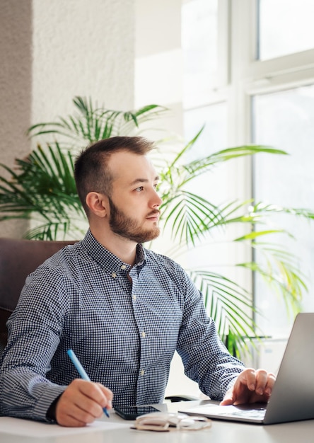 Businessman working on his laptop in an office