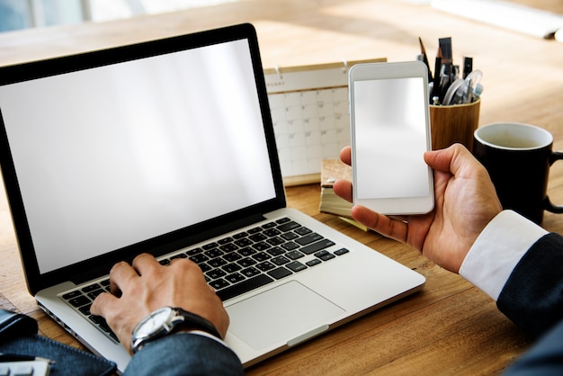 Businessman Working Hold Phone On A Wooden Table