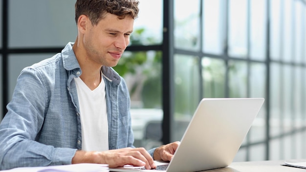 Businessman working on a laptop computer in the office