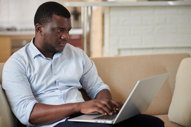 Businessman Working on Laptop at Home