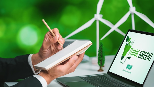 Businessman working in office developing plan on alternative energy gyre